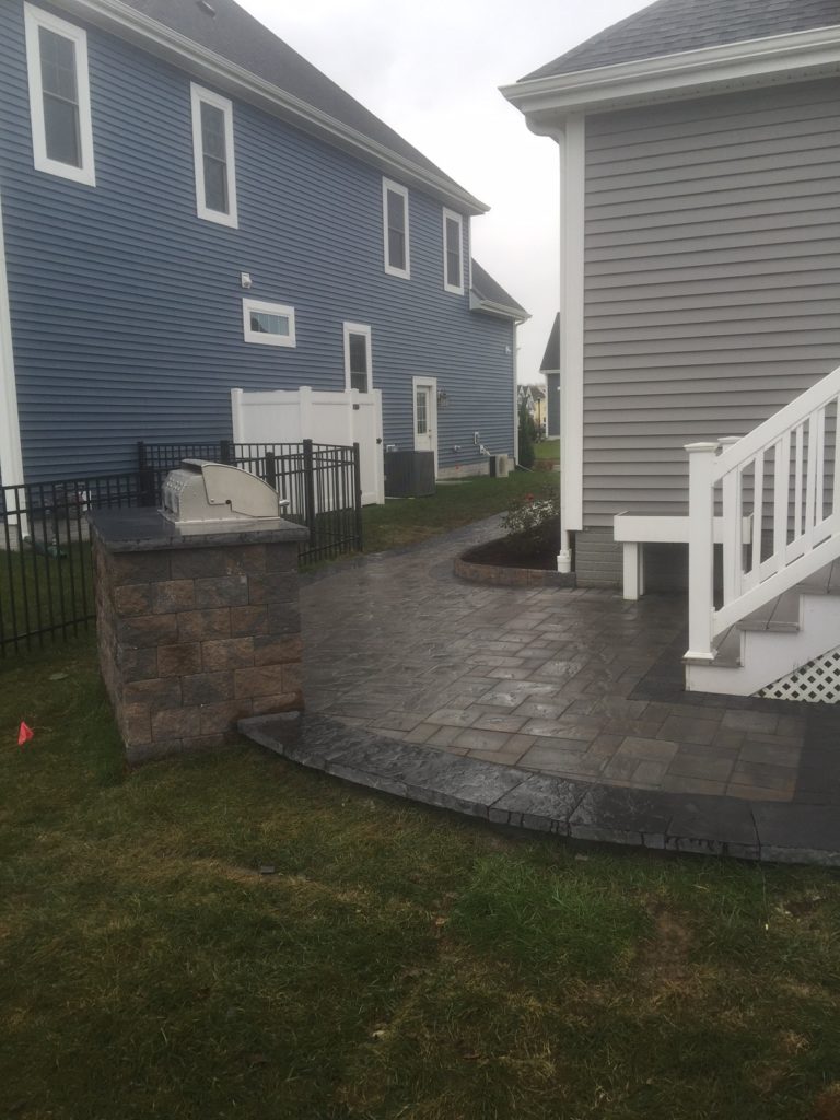 STI Patio and Walkwaybetween blue house and gray house