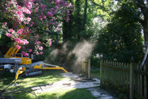 fence and landscaping remodel with bulldozer machine