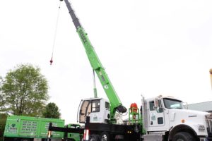 White truck with green crane at sussex crane