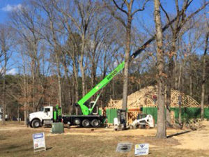 Crane at Construction Site with house being built